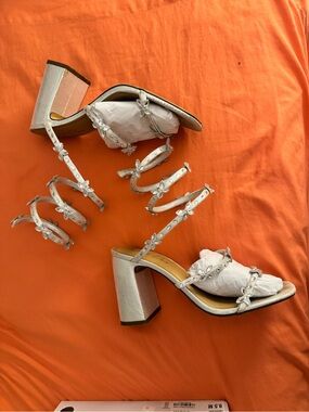 Wild Pair Silver heels Sz 9.5